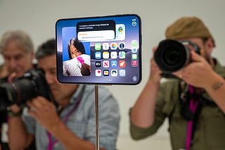 Journalists take photos of the new foldable iPhone Duo displayed during an Apple event at the Steve Jobs Theater in Apple Park in Cupertino, California, on September 9, 2026.