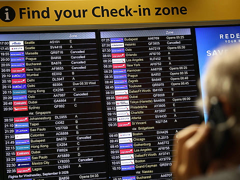 Cancelled flights are pictured on an electronic check-in display board at Terminal 3 of London Heathrow airport, west of London on September 8, 2026.