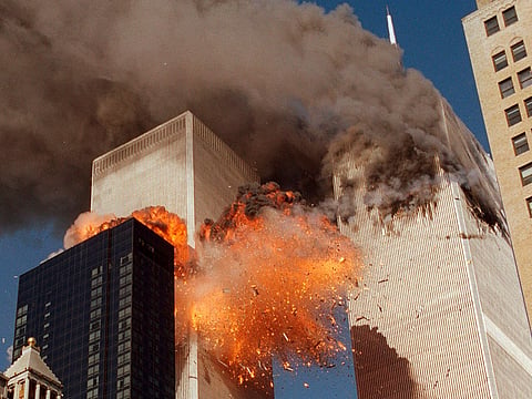 Smoke billows from one of the towers of the World Trade Center and flames and debris explode from the second tower in New York, Sept. 11, 2001