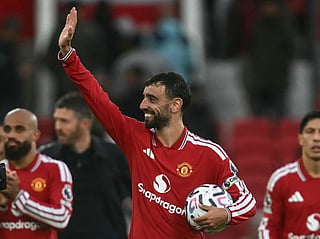 Manchester United's Portuguese midfielder #08 Bruno Fernandes (C) waves at the end of the match after getting a hat-trick during the English Premier League football match between Manchester United and Ipswich Town at Old Trafford in Manchester, north west England, on August 30, 2026.
