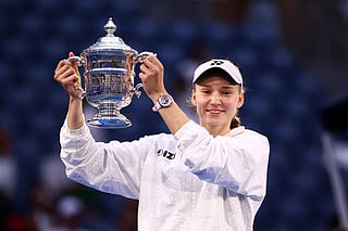 Kazakhstan's Elena Rybakina holds up the winner's trophy after winning the US Open women's singles final against Belarus's Aryna Sabalenka at the USTA Billie Jean King National Tennis Center in New York City on September 12, 2026.