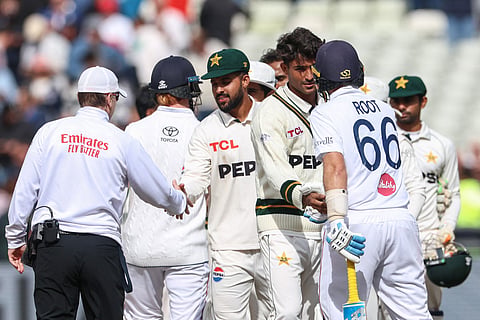 England's Joe Root (front R) shakes hands with Pakistan's Razaullah (2nd R) at the end of play on day four of the third Test match between England and Pakistan at Edgbaston cricket ground in Birmingham, central England, on September 12, 2026.