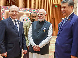 Indian Prime Minister Narendra Modi, center, reacts with Russian President Vladimir Putin, left, and Chinese President Xi Jinping during the BRICS summit in New Delhi, India, Saturday, September 12, 2026. 