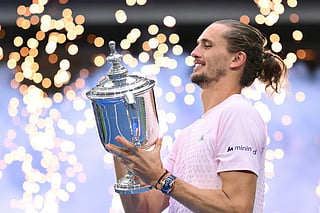 Germany's Alexander Zverev holds the trophy after defeating USA's Ben Shelton in the men's singles final tennis match on day fifteen of the US Open tennis tournament at the USTA Billie Jean King National Tennis Center in New York on September 13, 2026.
