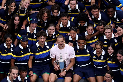 Alexander Zverev of Germany poses with the trophy and the US Open Ball Crew after defeating Ben Shelton of the United States in their Men's Singles Final match on Day Fifteen of the 2026 US Open at USTA Billie Jean King National Tennis Center on September 13, 2026 in the Flushing neighborhood of the Queens borough of New York City.