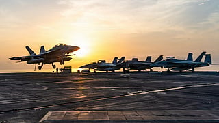 This handout picture released by the US Navy on September 13, 2026, shows an F/A-18 Super Hornet, attached to Strike Fighter Squadron (VFA) 102, landing aboard Nimitz-class aircraft carrier USS George Washington (CVN 73) on September 13, 2026.