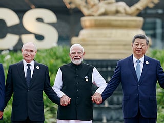 Russian President Vladimir Putin, left, Indian Prime Minister Narendra Modi, centre, and Chinese President Xi Jinping, pose for a photo during the BRICS summit in New Delhi, India, Saturday, September 12, 2026. 