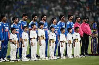 India's team players stand for the national anthem next to the trophy before the start of the first T20 international cricket match between India and Afghanistan at the Arun Jaitley Stadium in New Delhi on September 13, 2026.