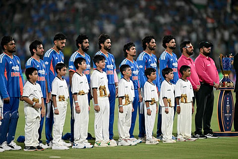 India's team players stand for the national anthem next to the trophy before the start of the first T20 international cricket match between India and Afghanistan at the Arun Jaitley Stadium in New Delhi on September 13, 2026.