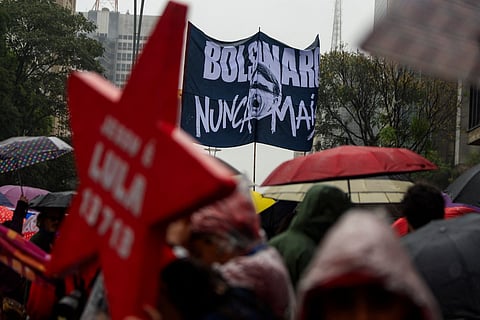 A supporter of Brazil's President and re-election candidate Luiz Inacio Lula da Silva holds a sign reading "Bolsonaro, never more" during a march within the Workers' Party (PT) national mobilization in Sao Paulo, Brazil on September 13, 2026.