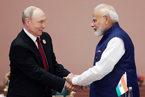 This handout photograph taken on September 13, 2026 and released by the Indian Press Information Bureau (PIB) shows India's Prime Minister Narendra Modi (R) shaking hands with Russia's President Vladimir Putin during the 18th BRICS Summit in New Delhi.