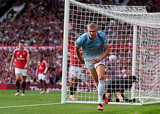 Manchester City's Erling Haaland celebrates after scoring his sides first goal during the English Premier League soccer match against Manchester United in Manchester, England, Sunday Sept. 13, 2026. (Peter Byrne/PA via AP)