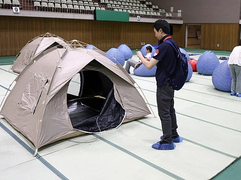 Tents and cushions are seen in a relaxation space set up at the support hub for Japanese team during the 2026 Asian Games, in Nagoya, Aichi prefecture on September 11, 2026.