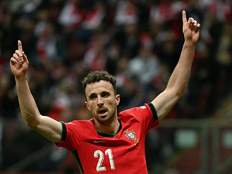Portugal's forward #21 Diogo Jota reacts after Poland's defender #05 Jan Bednarek scored an own goal during the UEFA Nations League, League A Group A1 football match Poland vs Portugal at the National Stadium in Warsaw, Poland on October 12, 2024.