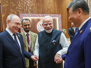 Prime Minister Narendra Modi with Chinese President Xi Jinping and Russian President Vladimir Putin at the BRICS Summit, in New Delhi on Saturday. 
