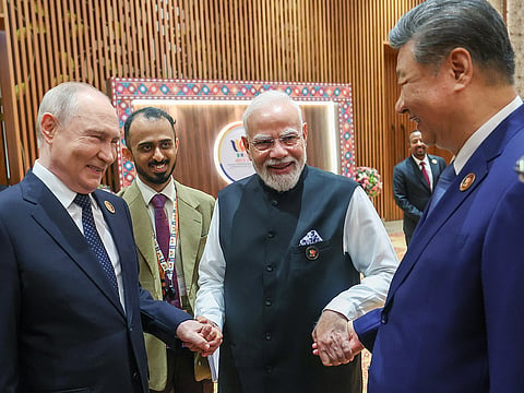 Prime Minister Narendra Modi with Chinese President Xi Jinping and Russian President Vladimir Putin at the BRICS Summit, in New Delhi on Saturday. 