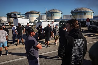 Several dozen fishermen stand after being evacuated by CRS riot police when they blocked an oil depot in the port of Fos-sur-Mer, France, to protest rising fuel prices and deteriorating working conditions, on September 15, 2026. Oil prices remain elevated, with Brent above $100 as of Sept. 30, 2026, due to Middle East tensions.
