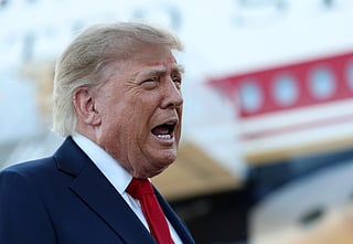US President Donald Trump talks with members of the media after walking off Air Force One at the Charlotte Douglas International Airport on September 16, 2026 in Charlotte, North Carolina.