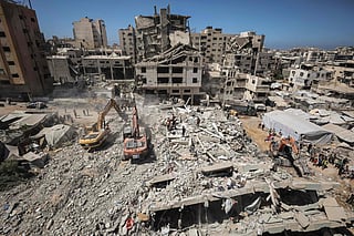 Rescuers excavate rubble to retrieve bodies from a collapsed building in the Tal Al Hawa area of Gaza City on September 16, 2026. 