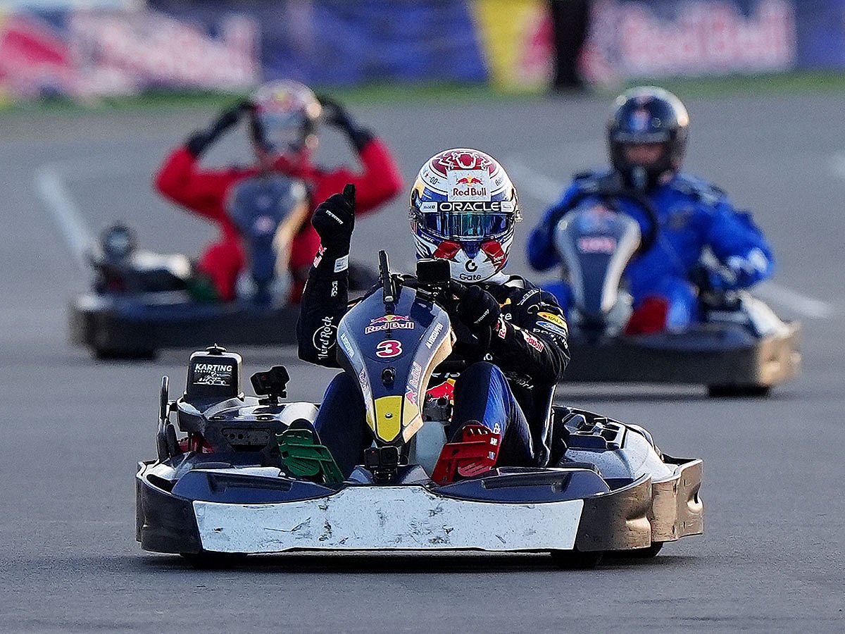 Red Bull's F1 driver Max Verstappen (3) celebrates winning the Max v 100 go-karting event at Silverstone.