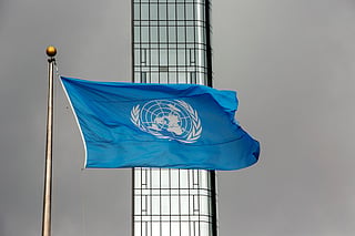 FILE - The UN flag flies on a stormy day at the United Nations during the United Nations General Assembly, Sept. 22, 2022. (AP Photo/Ted Shaffrey, File)