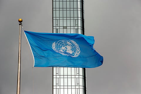 FILE - The UN flag flies on a stormy day at the United Nations during the United Nations General Assembly, Sept. 22, 2022. (AP Photo/Ted Shaffrey, File)