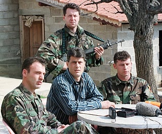 FILE - Hashim Thaci, head of the Kosovo Albanian negotiation team and head of the Kosovo Liberation Army political directorate (centre), addresses a press conference in a secret location in central Kosovo, Saturday, March 13, 1999. (AP Photo/Visar Kryeziu, File)
