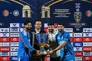 India's captain Shreyas Iyer (L) and his Afghan counterpart Ibrahim Zadran (R) pose with the winning trophy at the end of the third T20 international cricket match between India and Afghanistan at the Arun Jaitley Stadium in New Delhi on September 17, 2026.