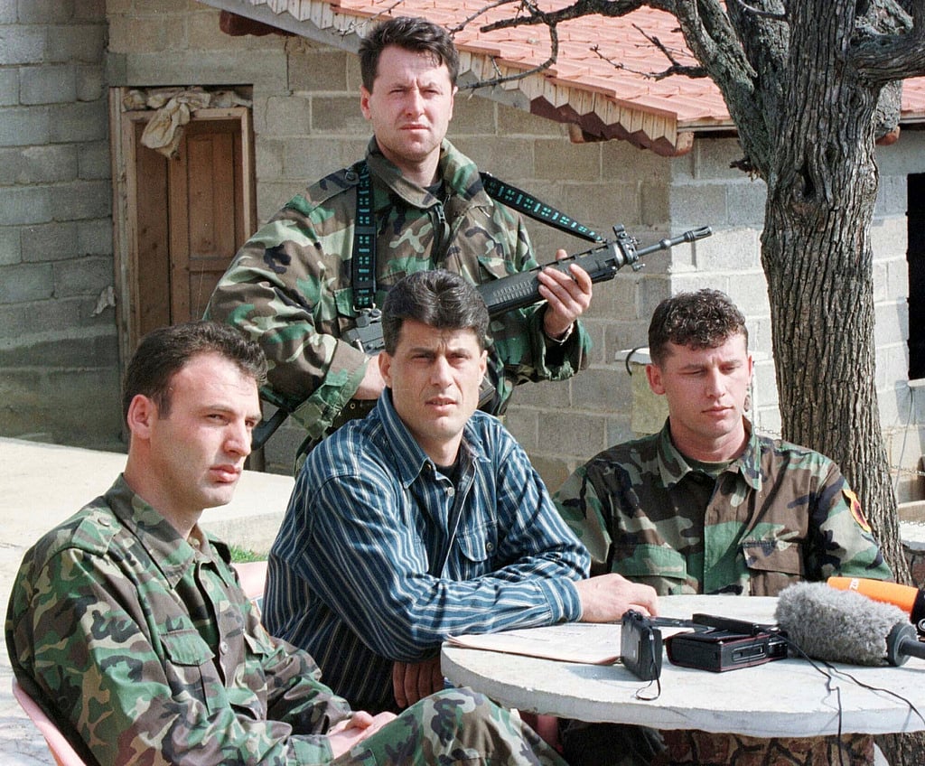 FILE - Hashim Thaci, head of the Kosovo Albanian negotiation team and head of the Kosovo Liberation Army political directorate, center, addresses a press conference in a secret location in central Kosovo, Saturday, March 13, 1999. (AP Photo/Visar Kryeziu, File)