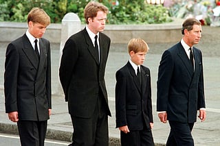 Britian's Prince William, Earl Spencer, Prince Harry and then-Prince Charles walk outside Westminster Abbey during the funeral service for Diana, Princess of Wales on September 6, 1997.