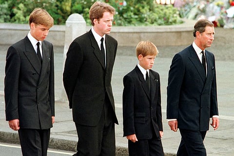 Britian's Prince William, Earl Spencer, Prince Harry and then-Prince Charles walk outside Westminster Abbey during the funeral service for Diana, Princess of Wales on September 6, 1997.