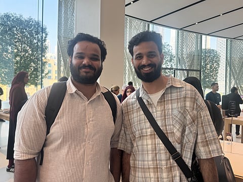 Mohammed Sayed from Kerala, pictured with his brother, said he chose to buy the new iPhone in Dubai after comparing prices in the UAE and India, estimating savings of around ₹20,000 to ₹30,000.