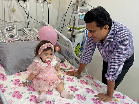 A young patient, Mirha, with Dr Vivek Mundada, Clinical Lead of the Gene Therapy Unit at Medcare Hospitals in the UAE.