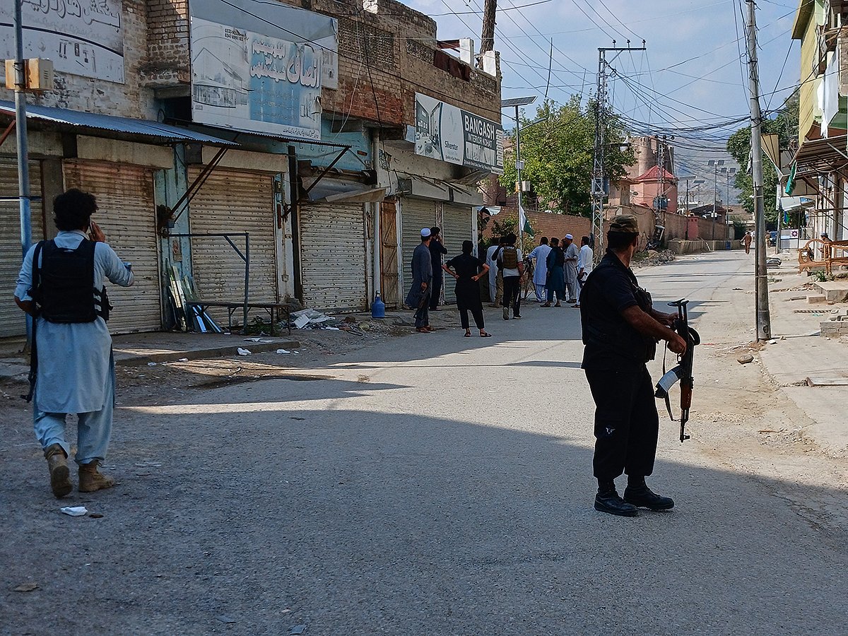 Police officers secure a road leading to the site of a powerful bomb at a mosque in Kohat, Pakistan, Friday, Sept. 18, 2026.