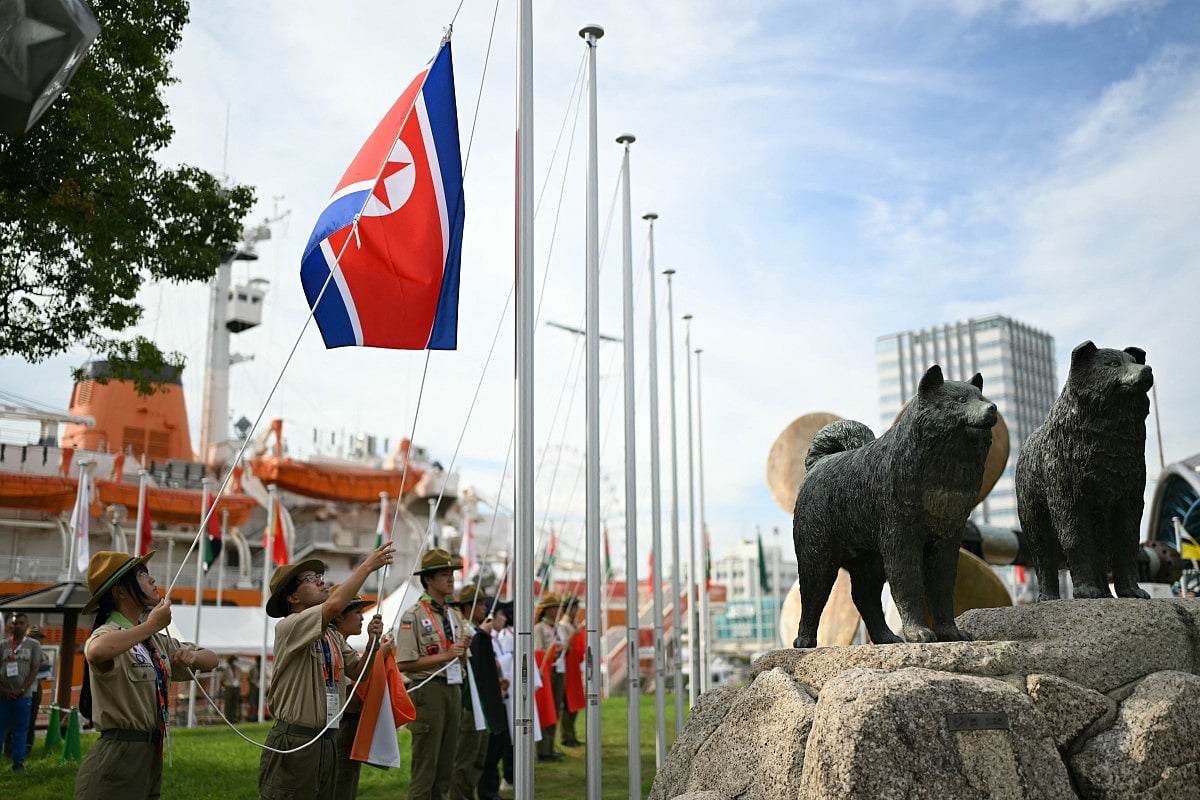 The North Korean flag is raised by scouts for the team welcome ceremony ahead of the 2026 Asian Games in Nagoya on September 18, 2026.