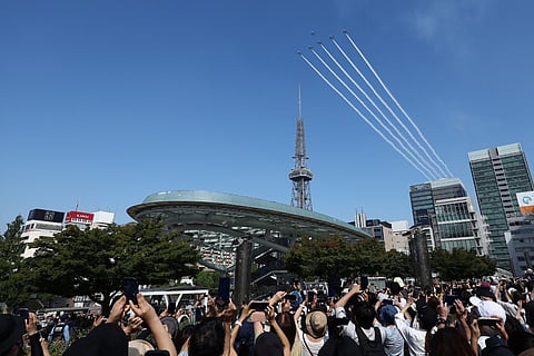 Kawasaki T-4s of the Japan Air Self-Defense Force's Blue Impulse aerobatic demonstration team perform a flypast ahead of the opening ceremony for the 2026 Asian Games in Nagoya on September 19, 2026.