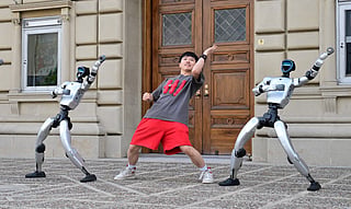 Chinese street dancer Wu Yufei performs alongside Unitree Robotics humanoid robots during a demonstration in Pasadena, California, on September 17, 2026, ahead of their performance in the Season 21 finals of "America's Got Talent" on September 22.