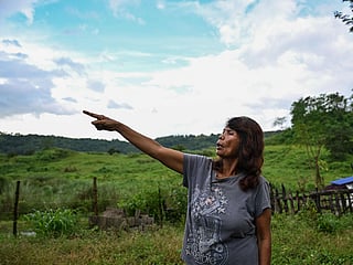 Petronila Munoz, a Filipino chieftain, pointing at the proposed land where the Pax Silica Hub might be built in Capas, Tarlac province.