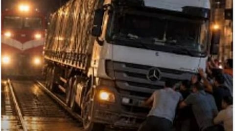 Truck driver dies of cardiac arrest after Egypt residents push his stranded lorry off railway tracks, narrowly avoiding a train collision in Dakahlia.