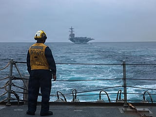 This US Navy handout photograph released by US Naval Forces Central Command on September 9, 2026, shows a US Sailor standing on the flight deck of Arleigh Burke-class guided-missile destroyer USS Mason on September 4, 2026. 