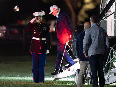 US President Donald Trump steps off from Marine One upon his arrival at the Ellipse just outside of the White House, in Washington.
