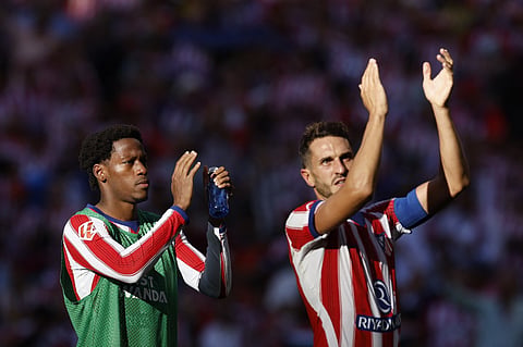 Atletico Madrid's Canadian forward #15 Jonathan David (L) and Atletico Madrid's Spanish midfielder #06 Koke react after the Spanish league football match between Club Atletico de Madrid and Real Madrid CF at the Metropolitano stadium in Madrid on September 20, 2026.