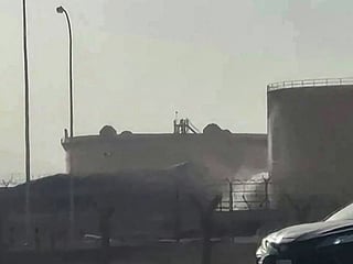 This frame grab taken from AFPTV video footage on September 19, 2026 shows a tank leaking at the scene of a fire at the Aramco fuel depot near King Khalid International Airport in Riyadh. 