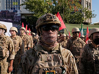 Armed personnel affiliated with Iran's Revolutionary Guard take part in the state-organized "Janfada," or "Sacrifice for Iran," military exercise in Tehran, Iran.
