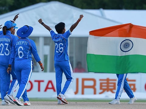 India's players celebrate their victory in the women's gold medal cricket match between India and Sri Lanka during the 2026 Asian Games.