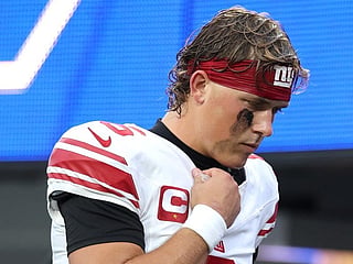Jaxson Dart #6 of the New York Giants walks back to the locker room after being injured in a play against Byron Young #0 of the Los Angeles Rams during the first quarter of the game at SoFi Stadium on September 21, 2026 in Inglewood, California.