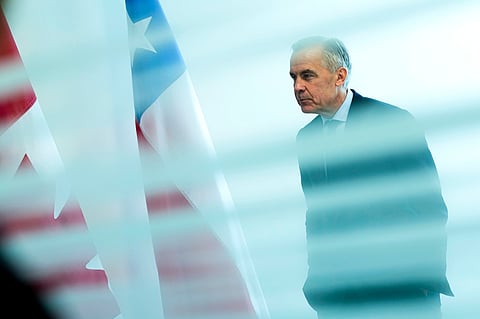 Canada Prime Minister Mark Carney is seen from behind a glass pane as he waits to meet with President of Chile José Antonio Kast, not shown, on the sidelines of the United Nations General Assembly (UNGA) at the UN headquarters on Tuesday, Sept. 22, 2026. (Justin Tang/The Canadian Press via AP)