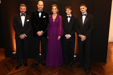 Britain's Prince William, Prince of Wales and Britain's Catherine, Princess of Wales pose for a photo with David Beckham and his sons Cruz and Romeo while attending the global premiere of the film 'Digger' in Leicester Square in central London on September 22, 2026.