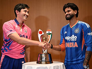India's captain Shreyas Iyer (R) shakes hands with Japanese captain Kendel Kadowaki-Fleming during a press conference ahead of their T20 cricket match, in Tokyo on September 21, 2026.