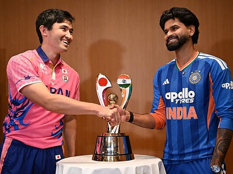 India's captain Shreyas Iyer (R) shakes hands with Japanese captain Kendel Kadowaki-Fleming during a press conference ahead of their T20 cricket match, in Tokyo on September 21, 2026.